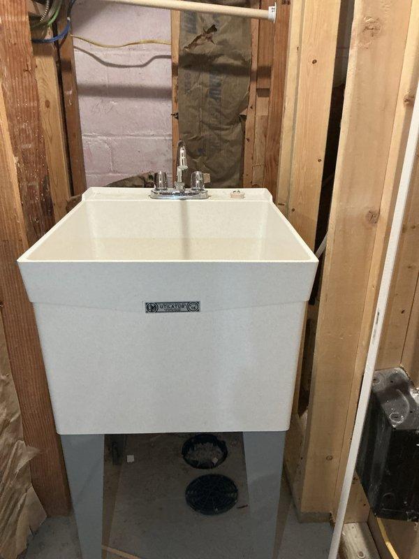 Conducted comprehensive plumbing inspection for new homeowner to assess overall system functionality with emphasis on faucet fixtures throughout the property. Evaluated bathroom plumbing including toilet, pedestal sink, and bathtub fixtures for proper operation and potential issues. Inspected utility sink installation in basement area, examining chrome faucet assembly with hot and cold handles for leaks, water pressure, and proper mounting. Provided detailed estimates for identified repairs and recommended maintenance items to ensure all plumbing fixtures meet operational standards.