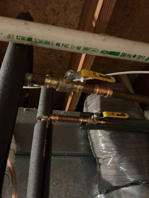 Completed installation of new laundry utility sink with brass top-mount faucet and washer stops in mechanical room. Installed three 3/4" ball valves on copper supply lines to provide shutoff capability for the plumbing system. All fixtures and valves were properly secured and tested for proper operation and leak-free connections.