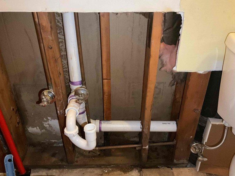 Completed sold repair per estimate involving cast iron drain line removal. Opened wall cavity to access plumbing system, cut out deteriorated cast iron piping, and exposed existing drain and supply lines for replacement work. Three hours of labor performed to complete demolition phase of the repair project.