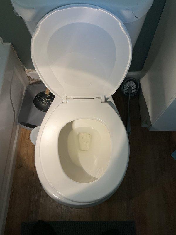 Responded to a severely plugged toilet at a duplex residence. Upon arrival, assessed the fixture and noted a cracked lid in addition to the blockage. Provided the customer with options for either clearing the existing obstruction or replacing the entire toilet unit. Proceeded with augering the drain line to remove the blockage. Successfully cleared the obstruction and restored proper drainage function. Performed multiple flush tests using substantial amounts of toilet paper to verify complete clearance and confirm reliable operation of the fixture.