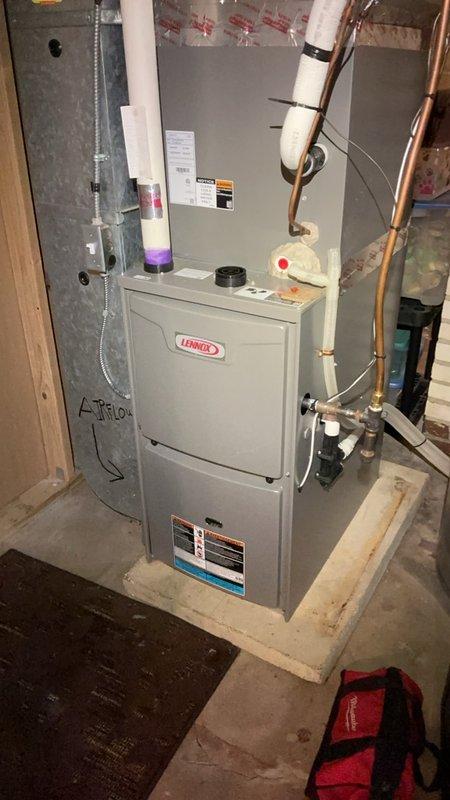 Completed comprehensive furnace tune-up on a 4-year-old Lennox heating system in preparation for winter operation. Performed thorough inspection and maintenance including scrubbing the flame sensor, inspecting heat exchanger for cracks or deterioration, checking blower motor and inducer motor operation, examining all electrical wiring connections, and verifying air filter condition. Flushed condensation drain line to ensure proper drainage and prevent blockages. Conducted carbon monoxide testing with readings within safe parameters. All system components found to be in good working condition with no deficiencies noted. Unit is operating efficiently and ready for the heating season.