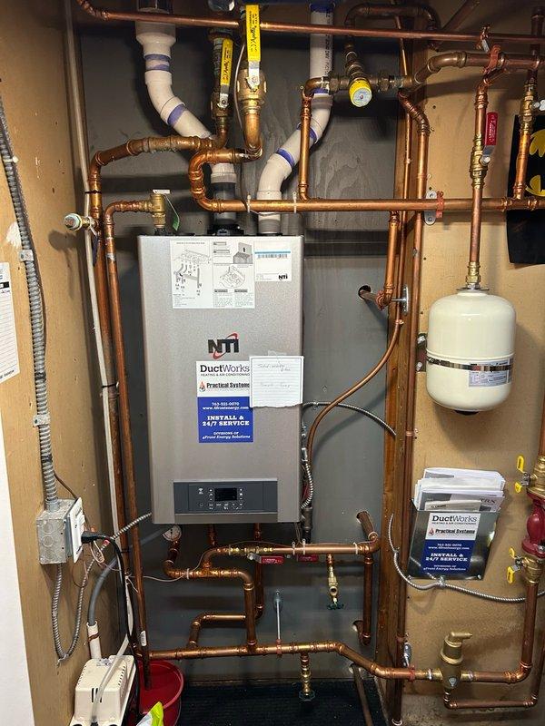 Completed annual fall heating maintenance on a 4-year-old wall-mounted boiler system. Performed comprehensive tune-up including inspection and cleaning of ignition sensor, inducer motor, air flow system, pressure switch, and gas valve. Conducted combustion analysis confirming system operating at 97.8% efficiency with safe carbon monoxide levels. Verified proper gas pressure and scoped heat exchanger with no defects found. Cleared condensate drain trap and removed buildup to ensure proper drainage. Inspected all copper piping connections, expansion tank, brass valves, and electrical components. System tested and confirmed operating properly with no safety concerns identified.