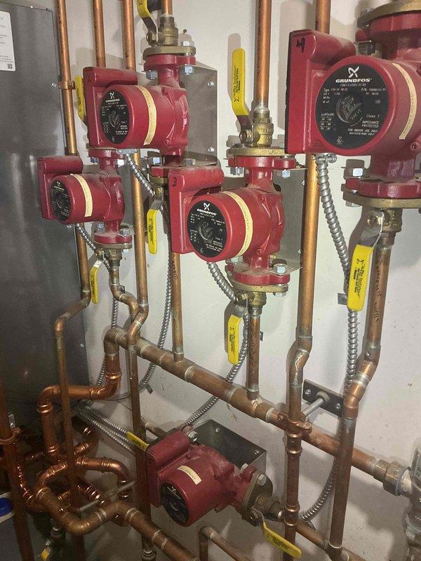 Responded to service call for leaking backflow preventer in mechanical room. Upon inspection, identified failed backflow prevention device on hydronic heating system supply line. Removed defective backflow preventer and installed new replacement unit with proper brass fittings and connections to copper piping. Ensured all connections were properly sealed and torqued to manufacturer specifications. Tested backflow preventer operation and verified proper function with no leaks detected. System returned to normal operation with all circulator pumps functioning correctly.