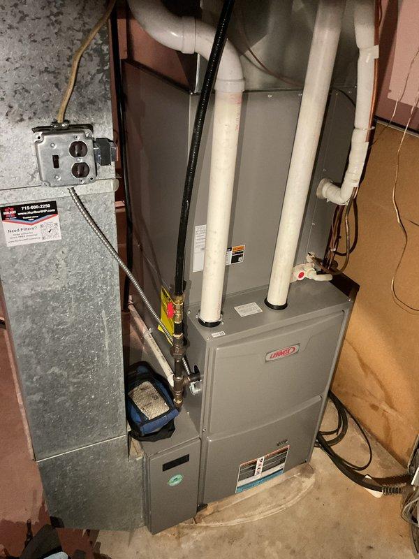 Completed scheduled heating maintenance on Lennox HVAC system as part of Family Rewards program agreement. Performed comprehensive tune-up inspection of furnace and air handler unit, verified all electrical connections and components operating properly, inspected PVC venting system and refrigerant lines, and documented equipment condition with photos. No issues identified during maintenance visit, system operating within normal parameters.