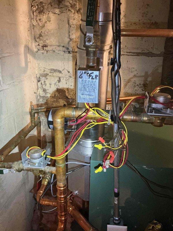 Responded to follow-up visit for boiler system installed in December. Customer reported previous return visits for pressure gauge reading incorrectly. Building inspector required gauge orientation changed from vertical to horizontal mounting to meet code requirements. Removed existing pressure gauge and connecting line from boiler system. Installed new pressure gauge in horizontal orientation per manufacturer specifications and inspector requirements. Verified all other system components including circulator pump, piping connections, brass fittings, and electrical connections remained operational and properly configured. Tested gauge for accurate pressure readings and confirmed proper system operation. Documented installation with photographs showing corrected gauge orientation and complete piping assembly.