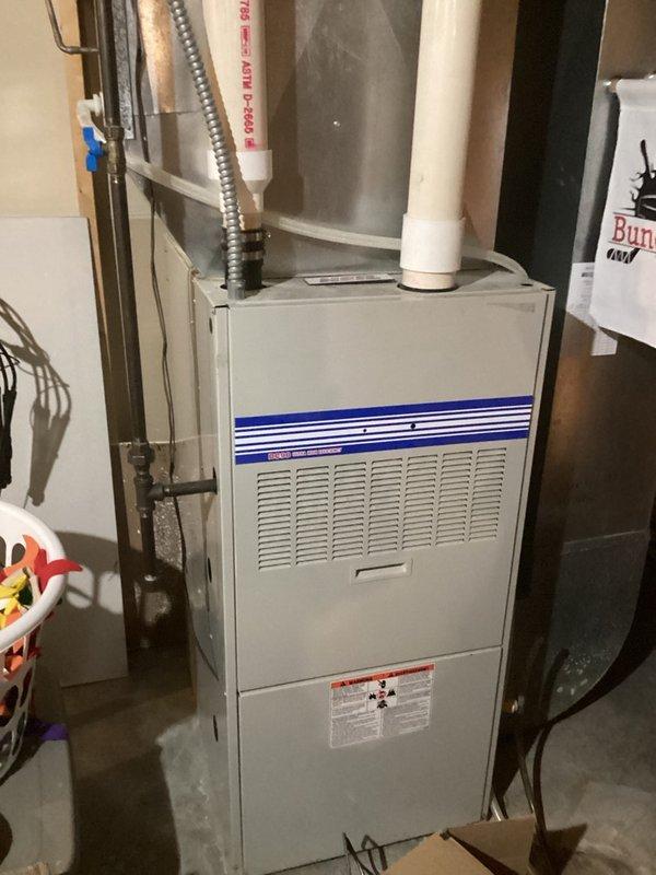 Responded to no hot water complaint at residential property. Upon inspection, found existing tanked water heater would not maintain ignition and blower motor exhibited severe mechanical failure with loud screeching noise. Unit age was unknown as occupants had recently moved into the property. Due to failed blower motor and ignition issues rendering the water heater inoperable, performed complete water heater replacement. Removed old unit and installed new tanked water heater with proper venting system to ensure safe exhaust of combustion gases and adequate air supply for burner operation.