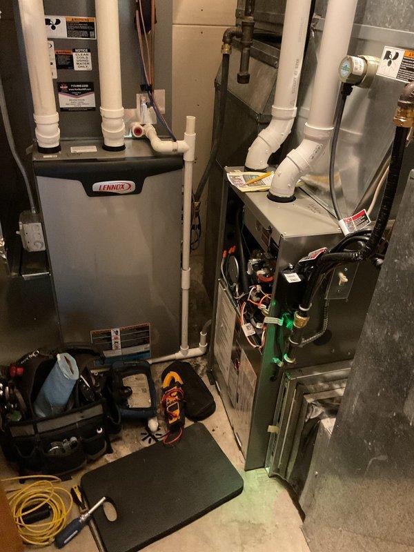 Completed annual maintenance on two residential furnaces in basement mechanical room. Both units were thoroughly inspected and serviced according to standard tune-up procedures. The 3-year-old Lennox furnace and 8-year-old unit both received full preventative maintenance including filter inspection, burner cleaning, heat exchanger examination, blower motor lubrication, and safety control testing. Verified proper operation of all components, checked gas pressure, tested ignition systems, and confirmed adequate combustion air supply. All venting connections and PVC condensate drain lines were inspected and found secure. Both systems are operating efficiently with no immediate concerns noted.