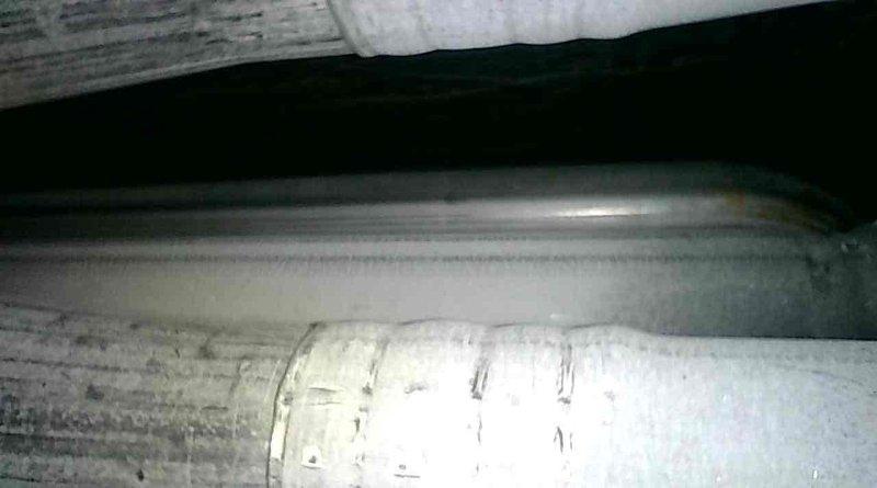 Performed comprehensive tune-up on 19-year-old Goodman furnace with no heat complaint. Inspected heat exchanger confirming no cracks or rust present. Cleaned flame rod and vacuumed all internal components including top and bottom chambers due to heavy dust accumulation. Verified CO levels at 15 PPM air-free and gas valve pressure at 3.5" WC within acceptable range.

During diagnostic testing, observed abnormal burner cycling pattern with flames igniting for approximately 5 minutes, shutting down, restarting, and eventually entering lockout mode after two cycles. Identified severely restricted airflow with minimal air movement detected at return vent and heavily soiled blower wheel, which is likely causing premature safety lockout due to inadequate air circulation across heat exchanger.

Discovered improperly installed inducer motor making contact with furnace cover panel, preventing proper reinstallation of cover. Homeowner confirmed previous inducer motor replacement by unknown techni