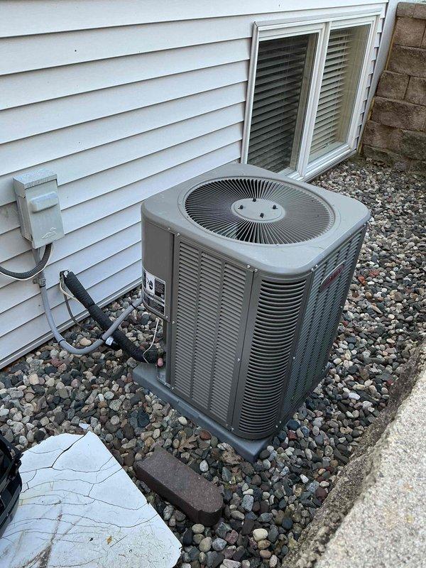 Completed comprehensive tune-up on 6-year-old air conditioning and furnace systems. Furnace inspection revealed heat exchanger clear of rust and cracks, cleaned flame rod, verified inducer and blower motor amperage within specifications, confirmed hot surface igniter ohms reading good, measured carbon monoxide at 18 ppm and temperature rise at 55 degrees with system heating properly. Air conditioning service included inspection of component box, verified capacitor and contactor in good condition, confirmed all amperage readings within acceptable range, and rinsed condenser coils with system cooling effectively upon completion.