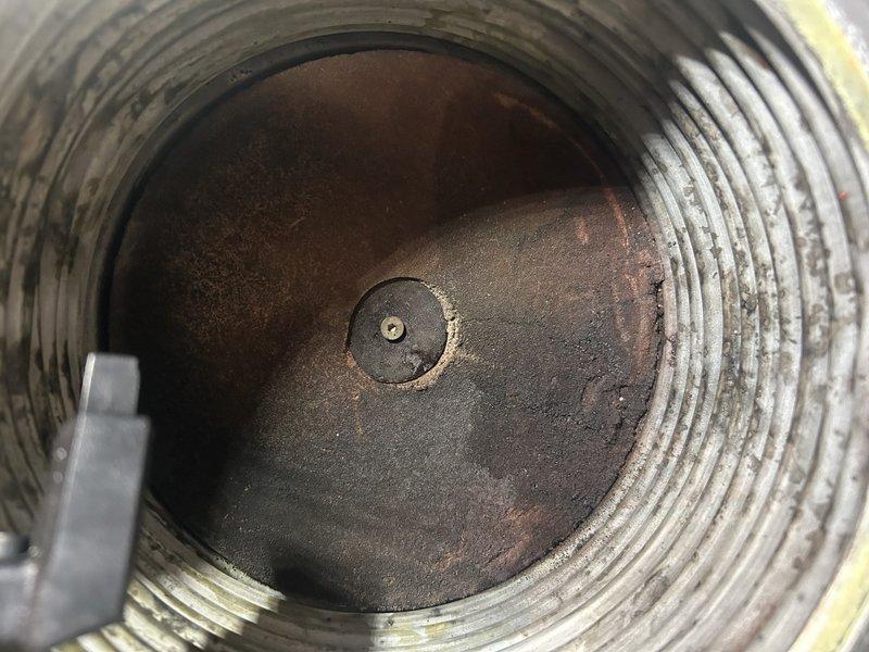 Performed scheduled maintenance on boiler system. Tested operational functionality and verified boiler pressure set at 15 psi. Expansion tank inspected and found in good condition. Removed and cleaned igniter and sensor components. Discovered debris buildup in bottom of heat exchanger and performed thorough cleaning of boiler interior. Cleared condensate trap of accumulated material. Reassembled all components and conducted final operational testing to confirm proper system function. All equipment operating within normal parameters upon completion.