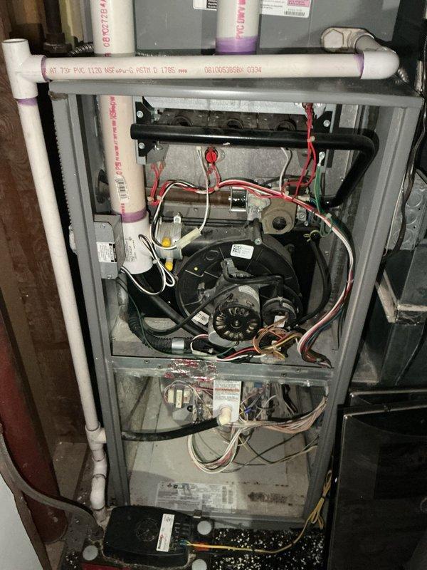 Responded to no heat call on 16-year-old furnace system. Upon inspection, diagnosed failed gas valve preventing ignition. Further evaluation revealed heat exchanger exhibiting severe temperature stress points, extensive rust, and corrosion throughout, creating potential safety concerns. Inducer draft motor showing signs of failure with abnormal operation. Due to multiple critical component failures and age of unit, recommended full system replacement rather than repairs. Documented conditions with photographs and scheduled furnace replacement estimate.