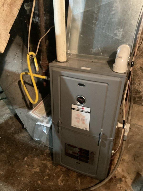 Responded to no heat call on 10-15 year old furnace where blower was operating but unit failed to produce heat. Upon inspection, discovered completely plugged air filter and failed control board. Evidence suggests AC condensate overflow migrated to control board causing electrical failure. Submitted parts request for replacement control board with customer callback required for pricing approval.