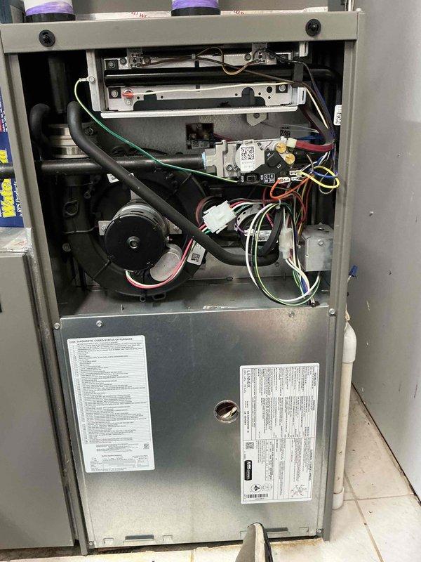 Responded to no heat call on Lennox furnace displaying Alarm ID 270 "GP Flame Failed To Ignite" error code on thermostat. Removed burner access panel and cleaned flame sensor to address ignition failure. System successfully ignited and maintained flame with burner cover removed, confirming proper combustion and heating operation for 20 minutes. However, flames extinguished when burner cover was reinstalled, indicating potential pressure switch issue or combustion air supply problem. Visually inspected fresh air intake at burner chamber with no visible obstructions found. Air intake and exhaust terminations located on roof were not accessible during this visit for thorough inspection. Unit operates and heats normally only with burner cover removed, suggesting improper pressure differential or combustion air flow restriction when cabinet is sealed. Follow-up service call required to inspect roof-mounted intake and exhaust venting system, verify proper termination clearances, check for bl