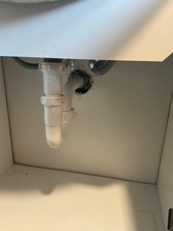 Responded to upstairs bathroom sink backup. Removed drain stopper and cleared hair accumulation from drain assembly. Plugged overflow opening and attempted plunging with no success. Disassembled P-trap beneath sink to inspect for obstruction—trap was clear, indicating blockage located further downstream in branch line. Cleaned accessible drain components and reassembled trap assembly. Performed camera inspection of main sewer line to assess overall drainage system condition and identify potential issues in the building's waste piping. Blockage in pipe was located and cleared. System restored to proper drainage function.