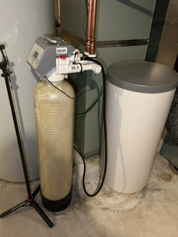 Completed comprehensive maintenance on 11-year-old HVAC system including furnace and AC tune-ups. During furnace inspection, discovered critical heat exchanger crack above and to the right of high limit switch, causing carbon monoxide to leak into living space, rendering unit unsafe for operation. AC system inspection revealed all components functioning within specifications with refrigerant levels reading slightly low but acceptable for winter season. Scheduled same-day estimate for furnace replacement.