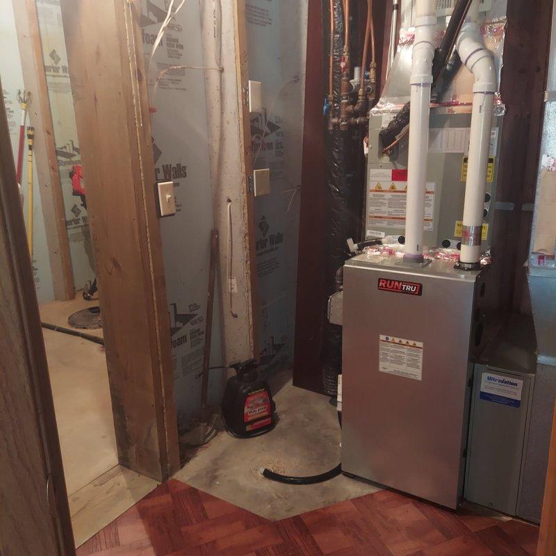 Completed comprehensive furnace tune-up and maintenance on 4-year-old RunTru gas furnace system in residential basement utility room. Performed full seasonal maintenance protocol including visual inspection of all system components, burner assembly cleaning, heat exchanger examination, ignition system testing, flame sensor cleaning, blower motor and wheel inspection, air filter evaluation, and verification of all safety controls. Checked and tested thermostat operation, confirmed proper airflow through ductwork, inspected venting system and PVC condensate drain lines for proper operation, and verified all electrical connections were secure. System tested under full operational load with no issues identified. All components functioning within manufacturer specifications. Reviewed complete maintenance procedures performed and workmanship guarantee details with homeowner on-site as requested. Unit operating efficiently with no repairs needed at this time.