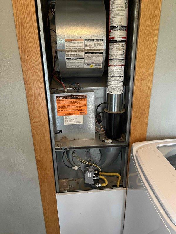 Replaced defective gas valve on residential furnace unit located in utility closet. Removed access panel, disconnected existing gas valve assembly, and installed new replacement valve. Reconnected yellow flexible gas supply line to valve inlet and verified all electrical connections to control board. Performed complete leak test on all gas connections using approved testing solution, confirming zero leaks at valve body and supply line connections. Conducted full operational test of furnace system, verifying proper ignition sequence, burner flame characteristics, and system cycling. Unit restored to safe, proper working condition.
