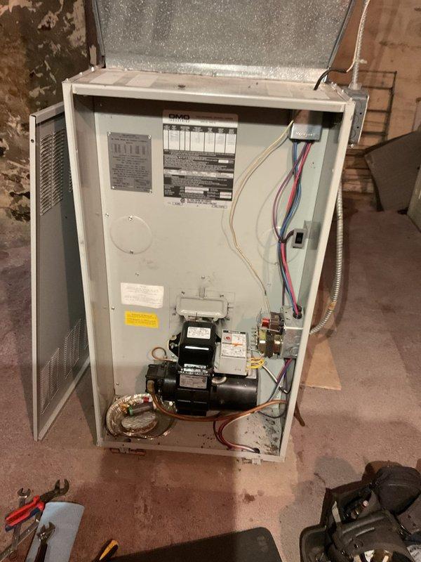 Completed comprehensive maintenance tune-up on three heating systems: geothermal heat pump, propane gas furnace, and oil furnace. Inspected geothermal unit, verified pressures and temperatures within specifications, added water to loop system, and checked all components with no issues identified. Performed full inspection of propane gas furnace including gas pressure verification at 7 inches WC, temperature rise measured at 55 degrees, combustion blower drawing 2.0 amps, igniter resistance at 21 ohms, and thorough heat exchanger inspection with no cracks detected. Replaced nozzle on oil furnace, inspected heat exchanger, and verified operational performance. Unit maintained at 50 degrees for unoccupied dwelling. Noted transformer showing signs of weakness and provided estimate for replacement. All systems operating properly upon completion.