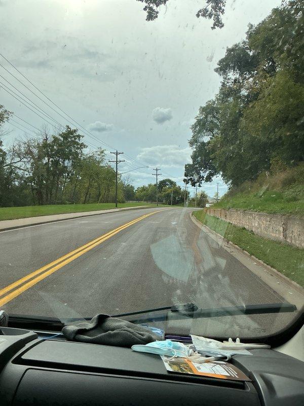 Completed phone follow-up regarding estimate discussion. Documented site conditions with photographs showing roadway access and property location for reference. Customer contact established to address estimate questions and provide requested information.