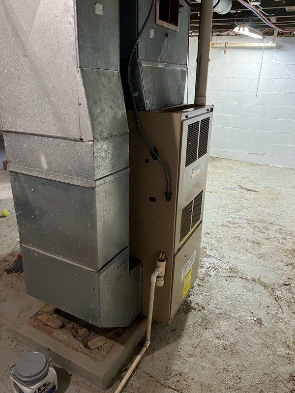 Responded to no heat call on 25-year-old furnace experiencing short cycling issues. Upon arrival, customer reported unit would ignite briefly then shut off immediately. Diagnosed faulty pressure switch that was not closing properly during ignition sequence, despite inducer motor pulling adequate vacuum. During inspection, identified blower capacitor reading out of specification and excessive play in blower wheel bearings indicating imminent failure. Completed comprehensive safety inspection with no additional compromises found. Provided estimates for immediate pressure switch replacement and future blower motor assembly replacement due to age and condition of unit. Part orders submitted and follow-up service scheduled for Tuesday.