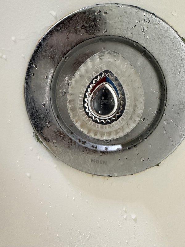 Completed comprehensive plumbing inspection for recurring maintenance service. Inspected ceiling-mounted Moen fixture showing age-related wear, discoloration, and dirt accumulation on metallic components. Evaluated copper pipe risers with U-shaped loops and shut-off valves featuring blue spoke-style handles; noted oxidized patina consistent with system age. Documented conditions and sent estimates for recommended repairs or replacements.