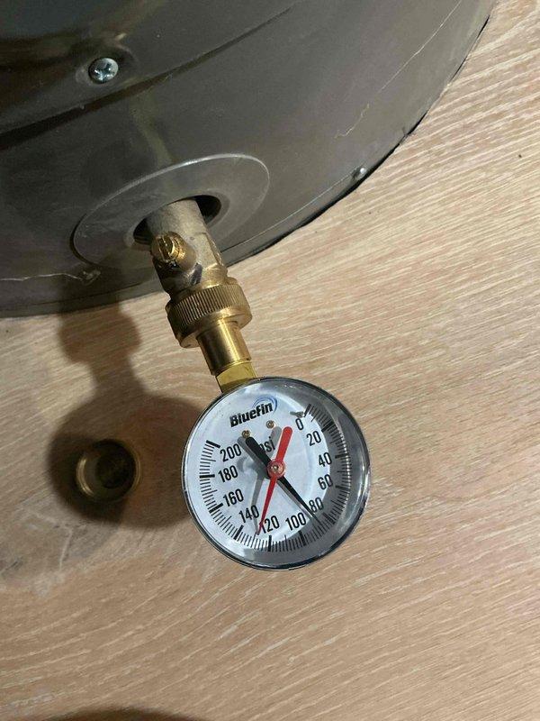 Completed biannual plumbing inspection including water heater tune-up and seasonal outdoor faucet service. Inspected water heater system, pressure gauge readings, and associated plumbing components. Identified anode rod requiring replacement and presented two solution options for corrective action.