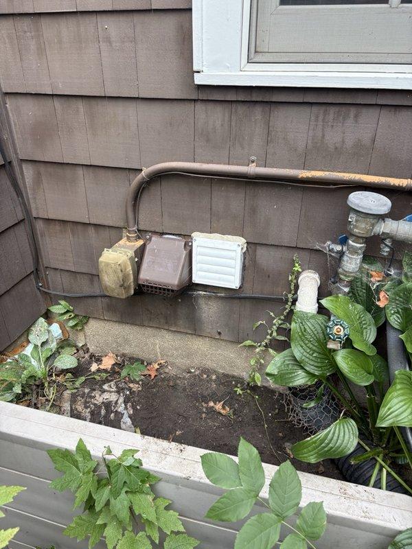 Responded to callback for incorrect hood installation on bathroom exhaust fan. Previous service had mistakenly installed dryer vent hood instead of proper bathroom fan termination. Removed incorrect dryer hood from exterior wall and installed correct white louvered bathroom exhaust vent cover. Verified proper connection to existing ductwork and confirmed adequate airflow through new termination. Installation complete and operational.