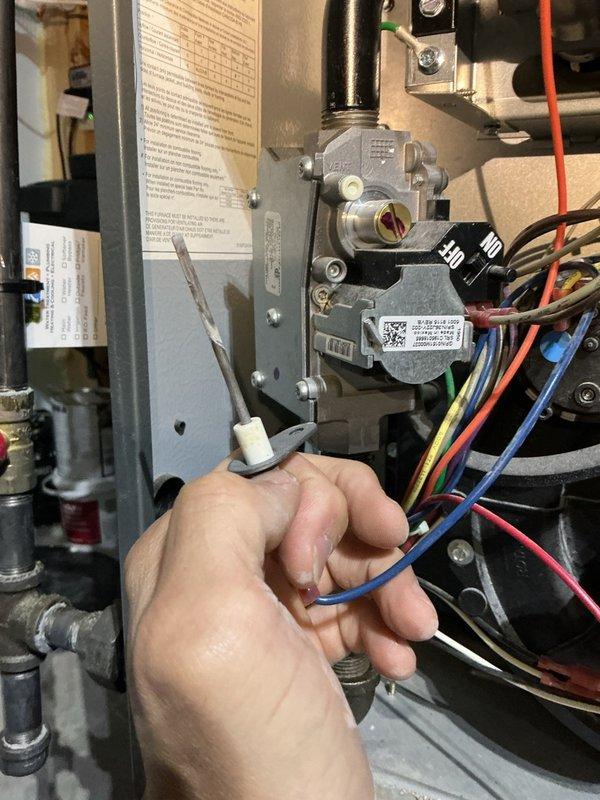 Completed comprehensive pre-winter maintenance on a 6-year-old Daikin furnace system. Performed full tune-up including flushing the condensation drain, cleaning the flame sensor, and conducting thorough inspection of heat exchanger, inducer motor, and blower motor—all components found in good working condition. Tested carbon monoxide levels at 16 ppm, which is within safe operating parameters. Verified air filter condition, confirmed proper operation of 2-zone motor system, and inspected ductwork with no abnormal sounds detected. Measured gas pressure at -0.45" W.C. and static pressure at 0.33" W.C. using dual port manometer to ensure optimal system performance. Despite initial customer concern regarding persistent ticking noise, no abnormal sounds were present during inspection. System tested, tuned, and confirmed ready for heating season.