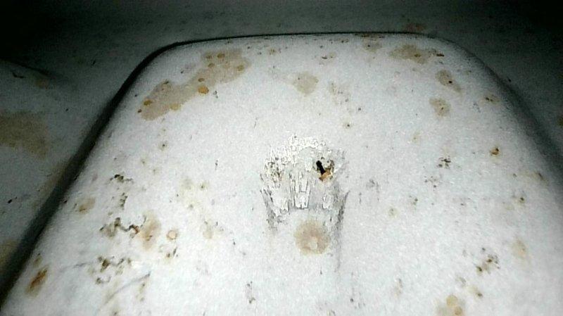 Responded to no heat call on 2017 gas furnace. Upon inspection, discovered gas valve sticking and impeding operation; temporarily freed valve to restore function. Conducted comprehensive safety inspection and heat exchanger evaluation, revealing multiple holes and compromises in primary heat exchanger. All other routine components tested within normal specifications. Due to cracked heat exchanger presenting carbon monoxide hazard, unit was red-tagged and taken out of service per safety protocols. Documented findings with photographs showing deteriorated heat exchanger surfaces with visible perforations and rust damage. Explained safety concerns and equipment condition on-site, recommended replacement options versus repair given age of unit and extent of heat exchanger failure.