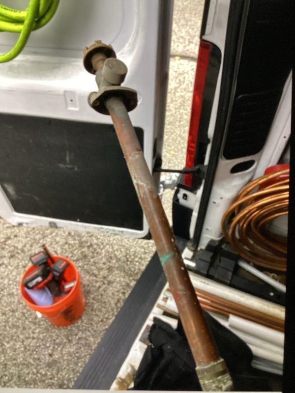 Responded to water leak causing visible staining on basement ceiling tiles. Conducted comprehensive plumbing inspection to locate source of moisture intrusion. Identified exterior hose bib with pinhole leak allowing water to penetrate through wall cavity and damage interior surfaces. Removed failed hose bib fixture and installed replacement unit. Coordinated with restoration company regarding water damage remediation to affected ceiling tiles and wall structure.