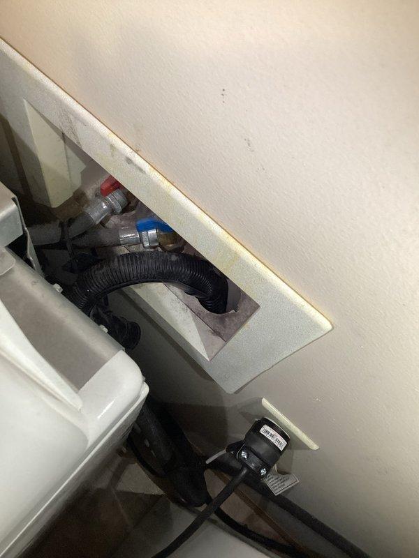 # Plumbing Service - Water Leak Inspection

Responded to service call for reported visible water leak with unknown source location. Performed comprehensive inspection of plumbing systems and water supply connections.

## Inspection Details

Conducted thorough examination of laundry area plumbing, including hot and cold water supply valves, appliance connections, and drainage systems. Inspected wall-mounted utility connections and drainage hose routing. Evaluated ceiling and wall areas showing signs of previous water damage and discoloration around pipe penetrations.

## Findings

No active leaks detected during inspection. All visible plumbing connections, supply valves, and drainage components showed no signs of current water seepage or moisture accumulation. Customer had not shut off water supply prior to inspection, allowing for assessment under normal operating conditions.

## Conclusion

Inspection revealed no plumbing deficiencies requiring immediate repair. Documented conditions