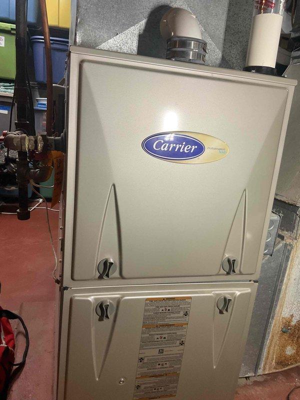Completed annual preventative maintenance heating visit on Carrier furnace and humidifier system. Performed comprehensive tune-up including electrical diagnostics with multimeter, inspected all mechanical components, tested system operation, and verified proper functionality of both units. All equipment operating within normal parameters with no issues found.