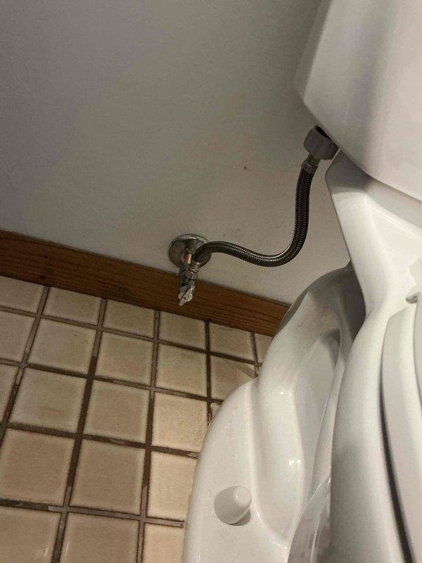 Responded to a toilet leak complaint and performed diagnostic evaluation. Upon inspection, identified active leaking from both the water supply line and fill valve assembly. The fixture stop valve exhibited severe corrosion, compromising its integrity and contributing to the leak condition. Proceeded with complete replacement of the deteriorated supply line, installing a new braided stainless steel flexible connector. Replaced the fill valve assembly with a new unit featuring improved shutoff mechanism. Due to the advanced corrosion on the existing fixture stop valve, removed and replaced with a new chrome-plated angle stop to ensure proper water control and prevent future leak issues. All connections were tested for leaks and proper operation. Toilet tank refill cycle verified for correct water level and shutoff functionality.