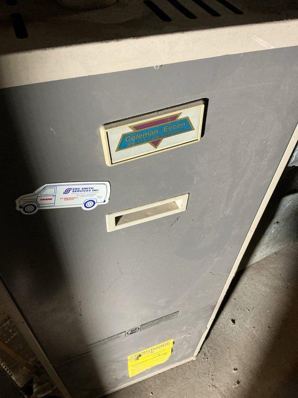 Responded to no heat call on Coleman-Evcon gas furnace over 20 years old. Upon inspection, found blower motor would not run consistently and had leaked oil. Diagnosed failed run capacitor as primary cause of intermittent blower operation. Verified heat exchanger integrity with no cracks or damage detected. Replaced failed run capacitor and blower motor to restore proper system operation. System tested successfully with blower running continuously and heat functioning normally.