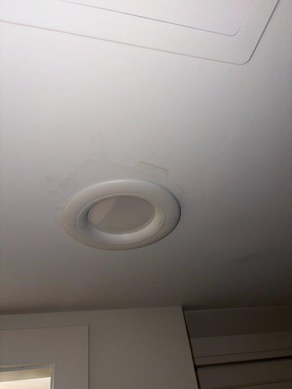 Responded to service call for moisture appearing through drywall with concern about ductwork leakage. Conducted thorough inspection of ductwork system and attic space, finding no active leaks in the duct system. Identified complete absence of insulation in attic as probable cause of condensation issue. Documented conditions with photos showing ceiling moisture staining, exposed floor joists, and plumbing infrastructure in uninsulated attic space. Advised customer that condensation on uninsulated ducts during cooling operation is likely source of moisture infiltration. Recommended adding proper attic insulation to prevent future condensation issues. Offered option to return during warmer weather for further diagnostic evaluation if moisture concerns persist after insulation improvements are made.