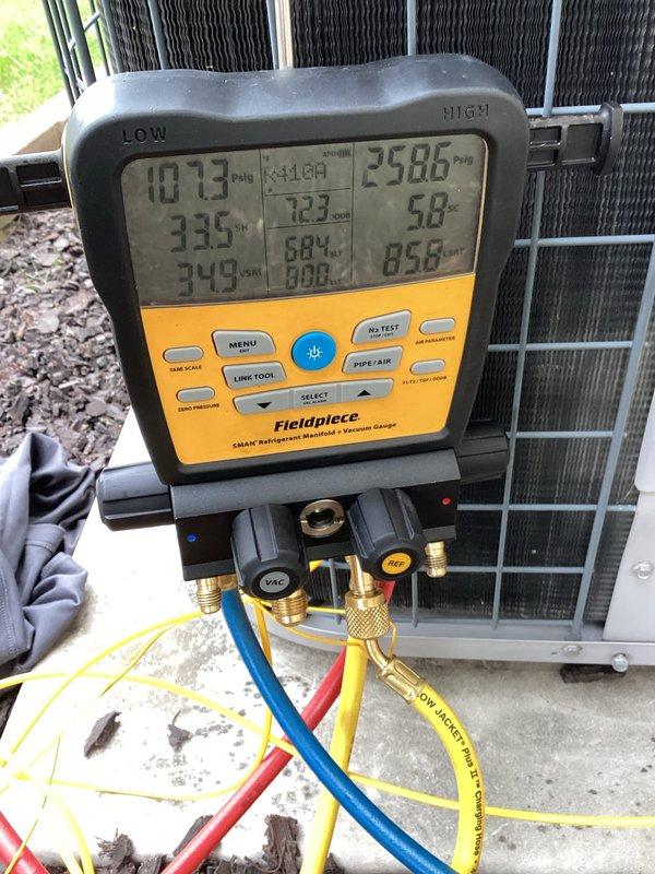 Responded to report of water leakage in basement originating from furnace area near water heater and dripping from filter location. Upon arrival, inspected condensing unit and A-coil assembly for drainage issues. Confirmed A-coil drain line was flowing properly with no blockages detected. Connected refrigerant manifold gauges to assess system performance and identified low refrigerant charge as primary issue affecting cooling capacity. Low refrigerant levels were causing inadequate dehumidification, resulting in excess moisture and water accumulation in basement area. Evaporator coil showed signs of dust and dirt buildup on fins, which can restrict airflow and contribute to condensation problems. Provided assessment and quote for refrigerant recharge to restore system to proper operating pressures and temperatures. Discussed long-term options including potential system replacement. Recommended monitoring system performance following refrigerant addition to ensure adequate cooling and p