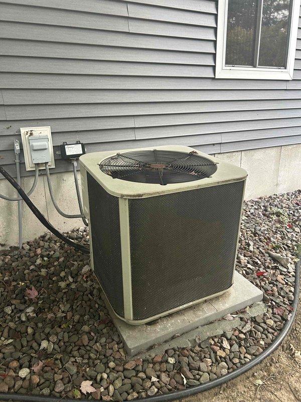 Completed heating tune-up on 20-year-old furnace and inspected 20-year-old AC system. Furnace appears functional but unable to perform heat exchanger camera inspection due to equipment malfunction. Provided homeowner instruction on humidifier operation and water panel replacement procedures. Evaluated AC unit that had failed to maintain setpoint on recent warm days; found R-22 refrigerant charge slightly low. Customer elected to defer AC repair until spring season.