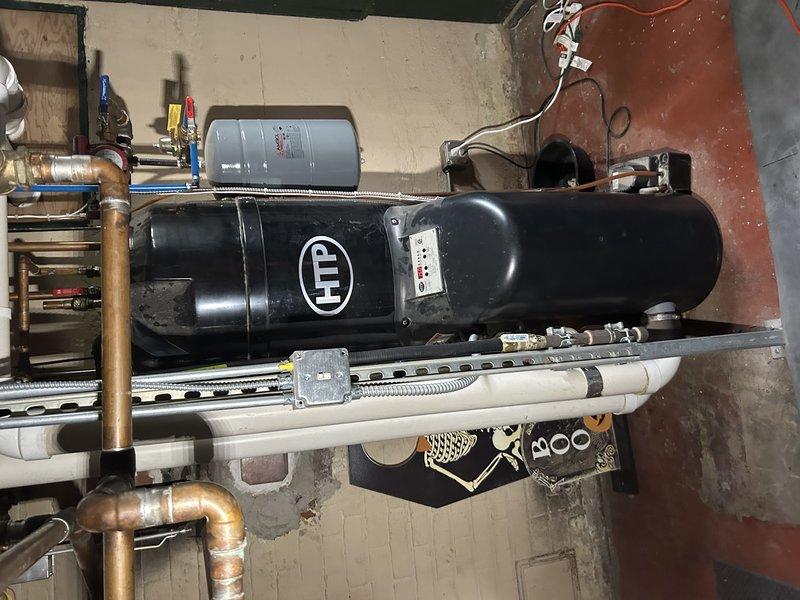 Performed scheduled maintenance on HTP boiler system serving both heating and domestic hot water. Verified proper operation of heating thermostats, confirmed boiler pressure settings, and tested system startup with successful heating cycle. Removed and cleaned flame sensor and igniter, flushed drain lines, and disassembled condensate pump to address poor drainage performance. Inspected burner assembly and heat exchanger, confirming all components are functioning properly with no issues detected.