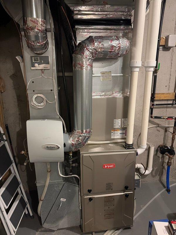 Completed heating tune-up on 4-year-old Bryant furnace located in basement mechanical room. Unit currently operating within normal parameters. Performed comprehensive maintenance inspection including heat exchanger evaluation, which revealed minor stress indicators but remains serviceable at this time. All system components, including integrated Aprilaire humidifier, tested and confirmed functional. Recommended monitoring system performance and advised customer to contact for service if any operational changes occur.