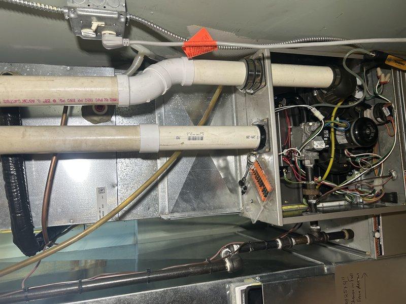 Completed comprehensive furnace tune-up and maintenance inspection. Tested all system operations with temperature rise confirmed within manufacturer specifications. Replaced air filter, verified gas pressure levels, and inspected flame sensor and igniter for proper function. Cleaned blower compartment and performed thorough heat exchanger inspection. Cleared condensate drain line and trap to ensure proper drainage. Identified moisture dripping from intake pipe onto gas valve and recommended installation of intake drain kit per manufacturer specifications to prevent future issues. All system components operating correctly at time of service.