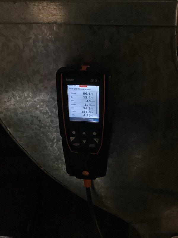Completed furnace tune-up and maintenance inspection per agreement. System operating properly with safe combustion, verified by flue gas analysis showing acceptable CO levels at 46 ppm and proper oxygen readings. Burner flames burning blue and evenly distributed across all ports. Temperature splits within manufacturer specifications. Air filter inspected and found to have remaining service life. Identified concerns including basement condensation and potential mold growth in ductwork that will require further attention. All electrical connections, gas valve operation, and control components functioning correctly at time of service.