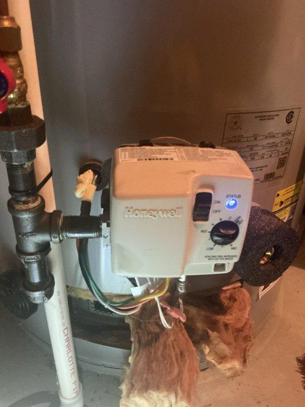 Responded to no hot water complaint on residential water heater experiencing soft lockout condition. Upon inspection, observed ignition control attempting to light but immediately shutting down when viewed through viewport, indicating flame sensor or gas valve failure. Diagnosed unit as beyond economical repair due to failed Honeywell gas control valve and age of equipment. Removed existing tanked water heater from utility area and provided replacement options. Completed full system evaluation including venting, gas supply lines, and electrical connections to ensure proper specifications for new installation.