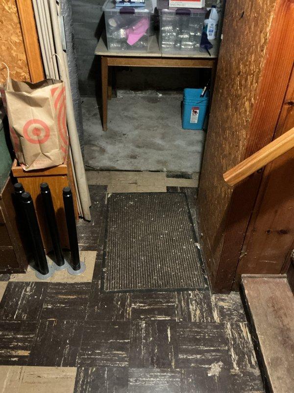 Responded to service call for intermittent floor drain backup in basement utility area. Upon inspection, identified floor drain with compromised metal grate and evidence of recurring water accumulation, as indicated by significant staining and discoloration on surrounding concrete floor. Assessed upstairs sink drain that had separated from cast iron connection at or below floor level, requiring attention in conjunction with floor drain issues.

Performed diagnostic evaluation of drainage system and determined floor drain required complete replacement. Evaluated existing plumbing configuration, including connection points to cast iron branch drain stacks. Provided comprehensive quote for floor drain replacement and repiping work to reconnect drainage system back to existing branch drain stacks. Documented conditions with photographs showing water damage patterns, drain condition, and overall plumbing layout in utility space. Also discussed water heater maintenance options as requested.