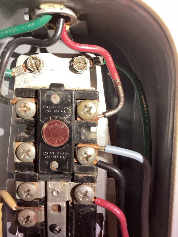 Responded to no hot water condition on 85-gallon electric water heater. Found ECO/safety shutoff had tripped due to overheating event. Reset ECO switch and verified power delivery to both thermostats and heating elements. Identified and cleaned burnt electrical connection at upper terminal and addressed corroded ground wire connection. Restored power to unit and confirmed proper voltage at both thermostats and heating elements. Unit operational at time of departure, though advised replacement should be considered due to age and condition of electrical components showing signs of deterioration.