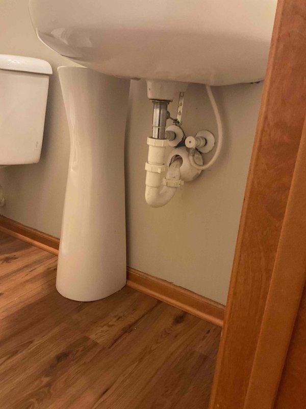 Returned to property following completion of flooring installation to reinstall toilet fixture. Successfully reconnected all plumbing connections and verified proper operation of the unit.