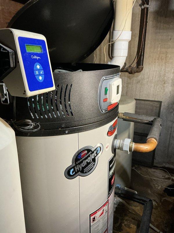 Responded to no hot water call for commercial tanked water heater. Upon arrival, inspected unit and confirmed lack of hot water production. Identified active leak at water heater with water intrusion in flame sensor area, compromising safe operation of the unit. Due to age of equipment, extent of water damage to internal components, and potential safety concerns with flame sensor contamination, provided estimate for complete water heater replacement rather than repair.