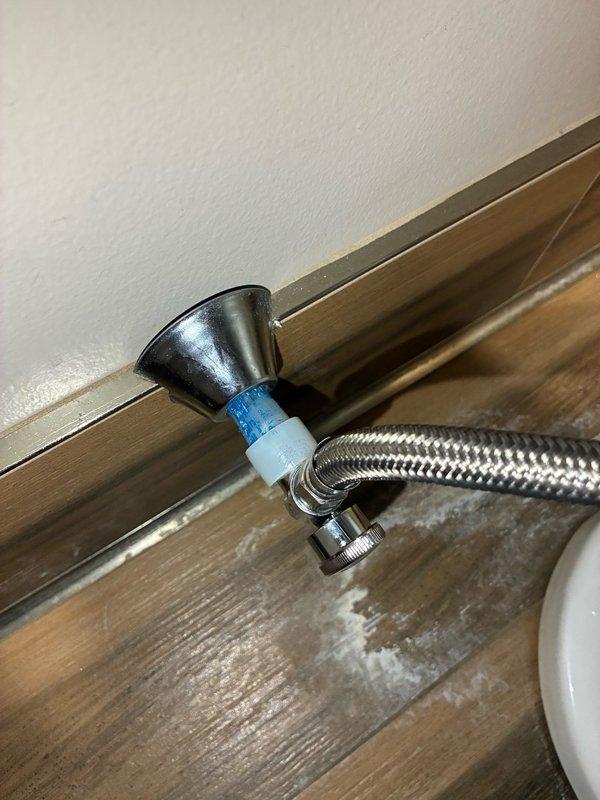 Responded to water staining around upstairs toilet. Upon inspection, flushed toilet multiple times to verify leak source was not at the base. Identified active leaks at both the supply line and angle stop valve. Removed existing SharkBite angle stop and installed a standard PEX angle stop. Replaced the toilet supply line with new braided stainless steel flexible connector. Verified all connections were secure and leak-free upon completion.