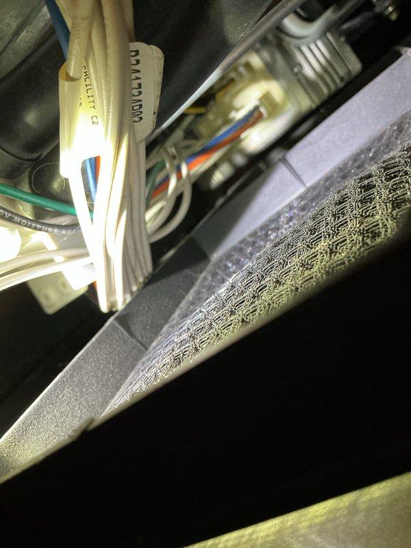 Performed furnace maintenance on a 10-year-old system and discovered a cracked heat exchanger located inside the high limit switch area along with dirty burners. Documented the cracked heat exchanger with photos showing visible fracture lines and assessed the condition of internal components including refrigerant lines and wiring. Recommended replacement of the heat exchanger and burners, and provided comfort advisor consultation for customer consideration.