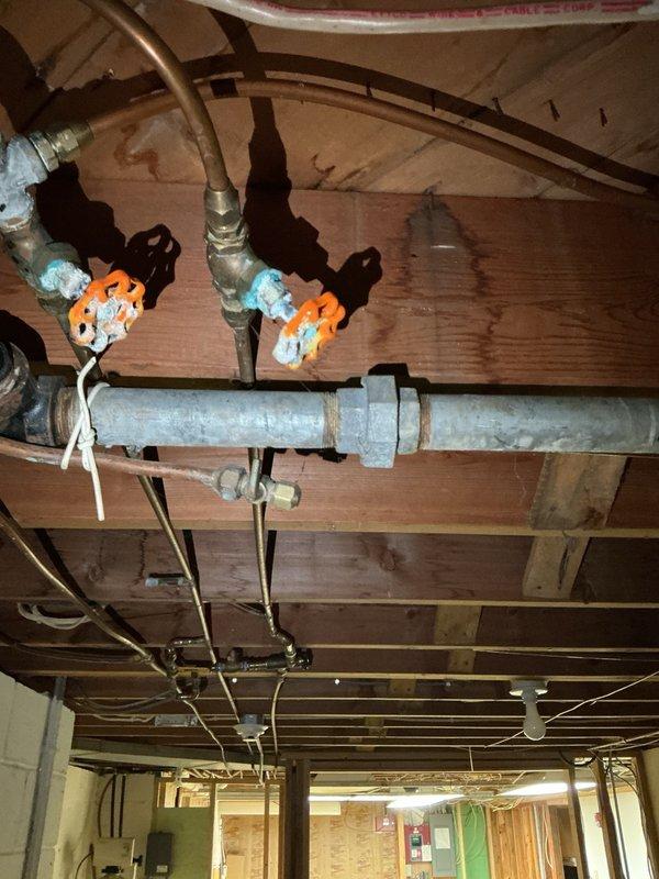 Responded to a washing machine backup caused by a clogged drain line. Upon inspection, discovered the washer drain line was heavily obstructed with accumulated hair and debris. Utilized a rigid drain cleaning machine to thoroughly clear the blockage and restore proper drainage function. Verified system operation upon completion.