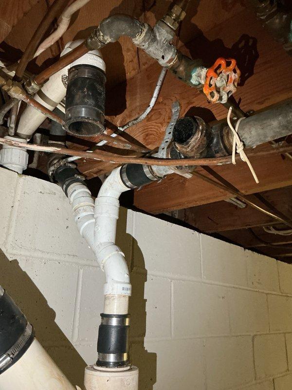 Responded to a washing machine backup caused by a clogged drain line. Upon inspection, discovered the washer drain line was heavily obstructed with accumulated hair and debris. Utilized a rigid drain cleaning machine to thoroughly clear the blockage and restore proper drainage function. Verified system operation upon completion.